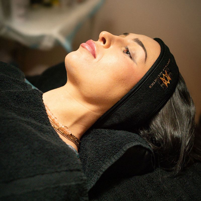 Photo of a woman laying down at a medical aesthetics spa.