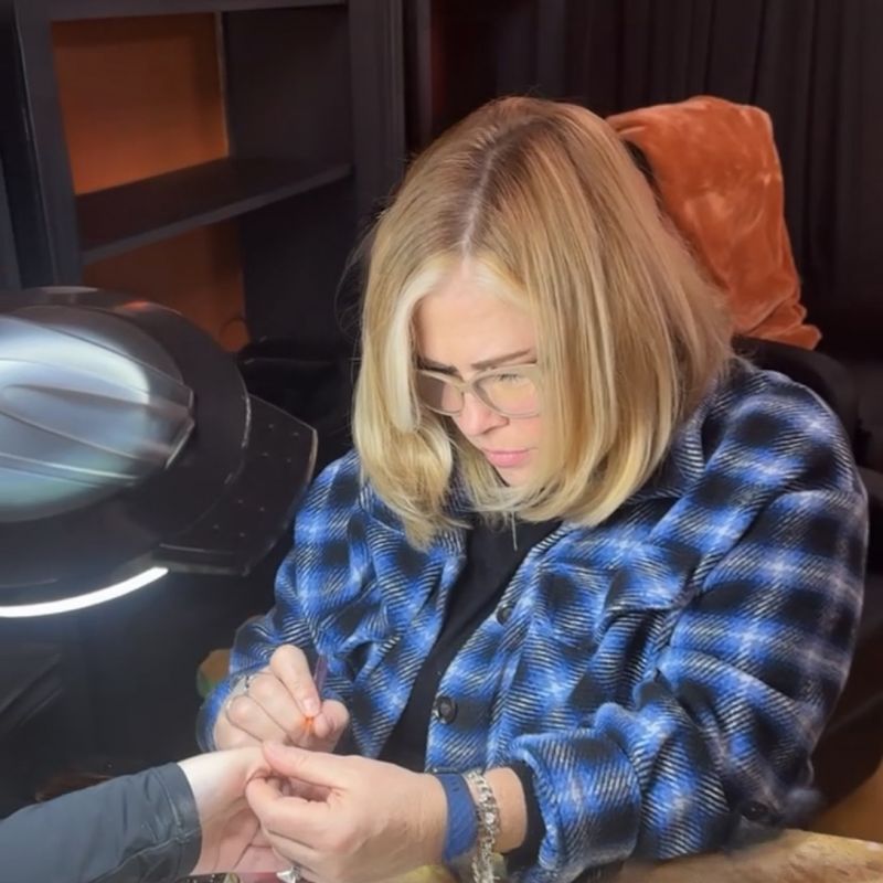 Photo of a woman doing natural nails at a natural nail salon in Canyon Lake Texas, Empower Aesthetics.